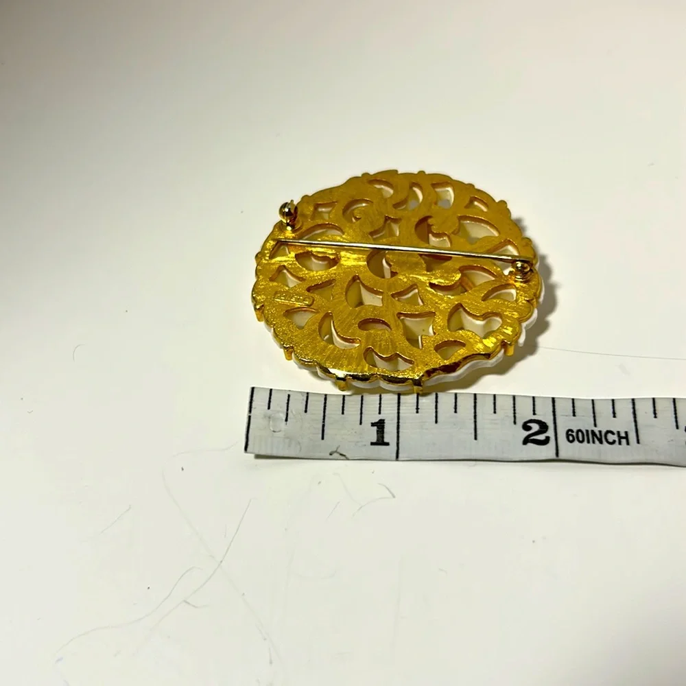 Monet brooch vintage filigree gold tone white cut out design 2 “